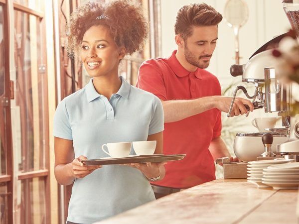 girl and boy in blue and red polo shirts